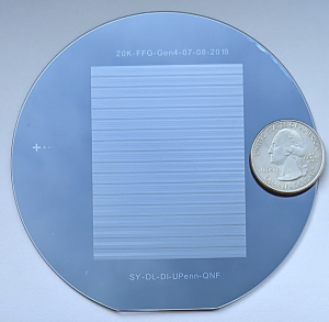 The Penn researchers' VLSMI Device: a silicon wafer, not much bigger than a quarter, with finely etched microfluidic channels that precisely package mRNA sequences into lipid nanoparticles.