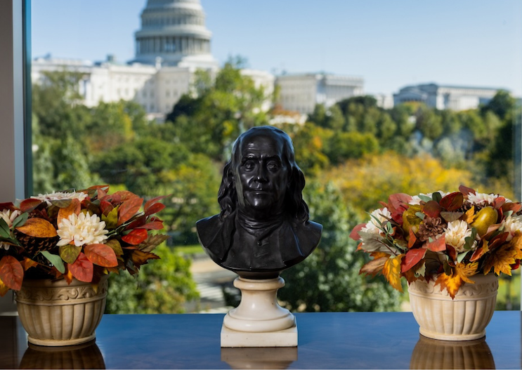 A Benjamin Franklin statue sits on a table at Penn Washington