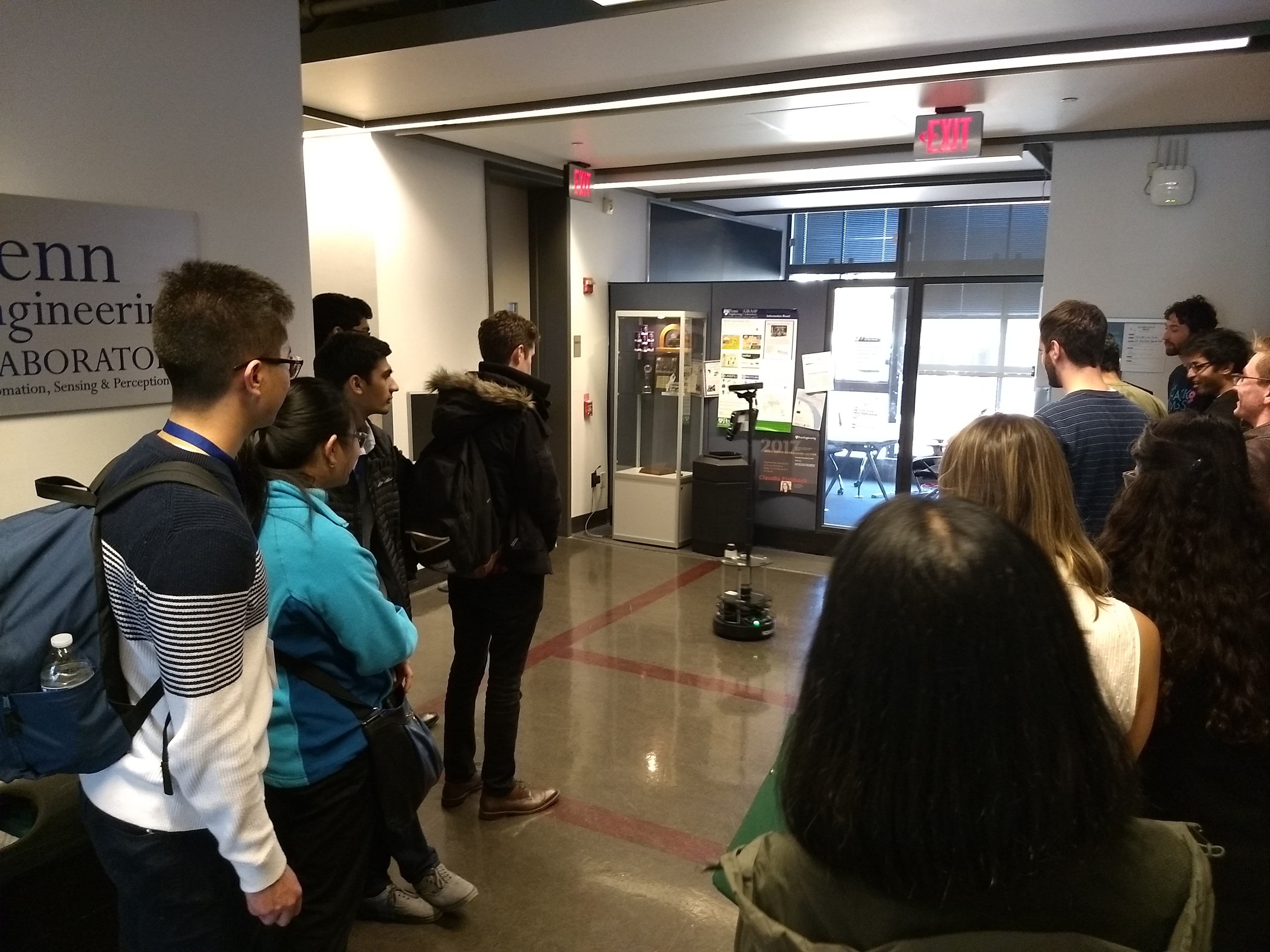 An earlier version of the autonomous service robot giving a tour to prospective PhD students.